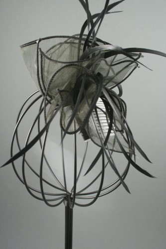 Black Looped Fabric and Feather Fascinator on a Clear Comb