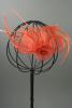 Coral Looped Fabric Flower and Feather Fascinator on a Ribbon Wrapped Aliceband.  - view 2