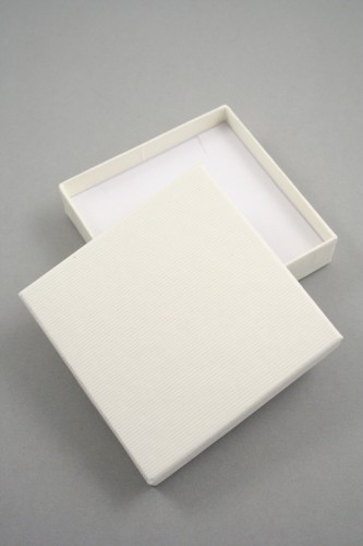 Lined Textured Cream Gift Box with White Flock Insert with two corner slits for a chain and a centre 40mm slit. Size 9cm x 9cm x 2cm.