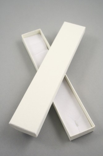 Lined Textured Cream Gift Box with White Flock Insert with white flock insert with a small wire hook at one end and an elasticated fitting at the other suitable for bracelets Size 21cm x 4cm x 1.8cm.