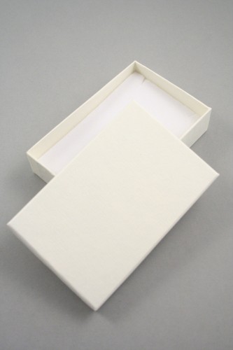 Lined Textured Cream Gift Box with white flock insert with top slits and holes for earrings Size 11cm x 7cm x 2.5cm.