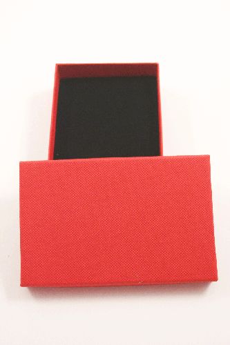 Red Gift Box with Black Flock Inner with top slits and holes for earrings. Approx Size 11cm x 7cm x 2.5cm