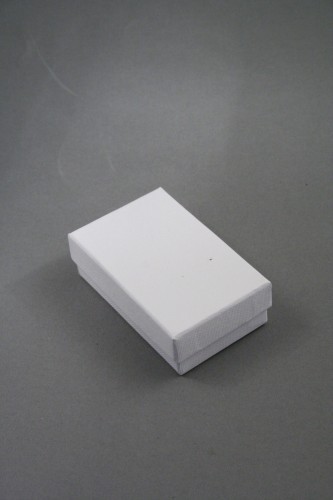 White Giftbox with White Flocked Inner. Approx Size 5cm x 8cm x 2.5cm.