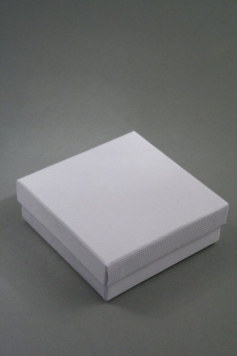 White Giftbox with White Flocked Inner. Approx Size 9cm x 9cm x 3cm.