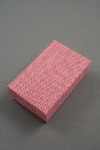 Pink Linen Effect Gift Box with Black Flocked Inner. Approx Size: 5cm x 8cm x 2.5cm.