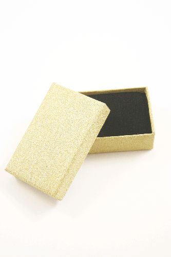 Gold Glitter Gift Box. Size Approx 8cm x 5cm x 2.5cm. This box has a black flocked foam pad insert with two corner slits for a chain and two 2cm centre slits