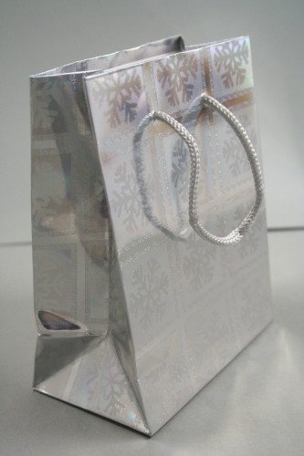 Silver Snowflake Christmas Print Holographic Gift Bag with Grey Cord Handles. Approx Size 14.5cm x 11.5cm x 6.5cm