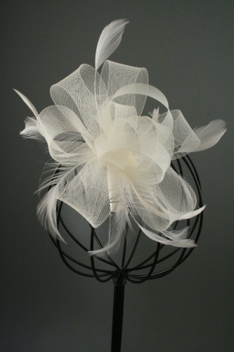 Cream Looped Net Ribbon and Feather Fascinator on a Clear Comb. 