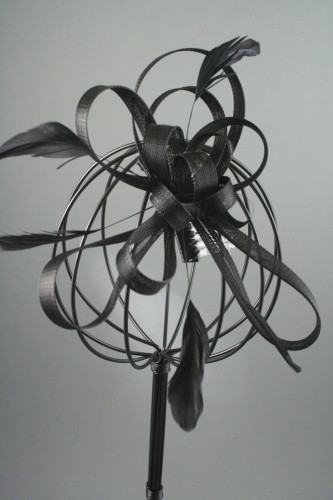 Large Black Coiled Net and Feather Fascinator on a Clear Comb. 