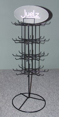 Jewellery Stand. 66cm tall incl header, 23 cm diameter. 32 hooks. Bottom row to take necklaces/bracelets. Other rows to take brooches, earrings, rings, etc. These stands are now in silver.