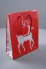 Glossy Red Christmas Gift Bag with White Reindeer Design. Red Corded Handles. Size Approx 22cm x 18cm x 7cm. - view 1
