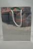Silver Snowflake Christmas Print Holographic Gift Bag with Grey Cord Handles. Approx Size 21.5cm x 18cm x 7.5cm - view 2