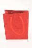 Red Glitter Paper Gift Bag with Cord Handles.  Size Approx 15cm x 12cm x 6cm. - view 1