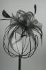 Black Looped Net Ribbon and Feather Fascinator on a Clear Comb.  - view 1