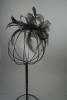 Black Looped Net Ribbon and Feather Fascinator on a Clear Comb.  - view 3