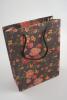 Black Floral Printed Kraft Paper Gift Bag with Black Corded Handles. Size Approx 20cm x 15cm x 6cm. - view 2